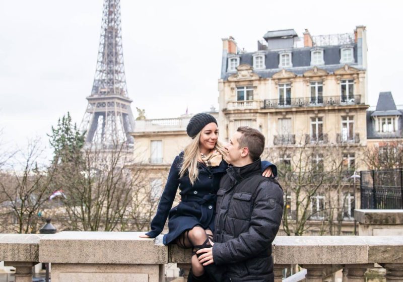 couple in paris before eiffel tower
