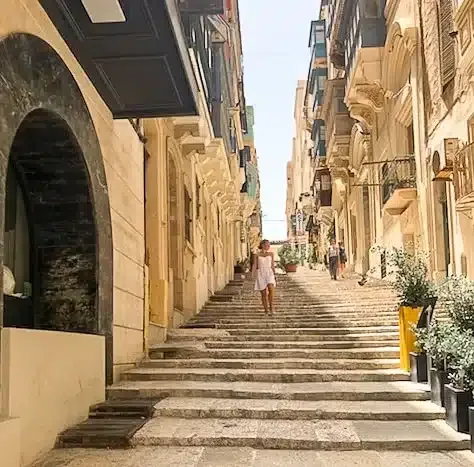 blonde girl in white dress in Valletta, Malta