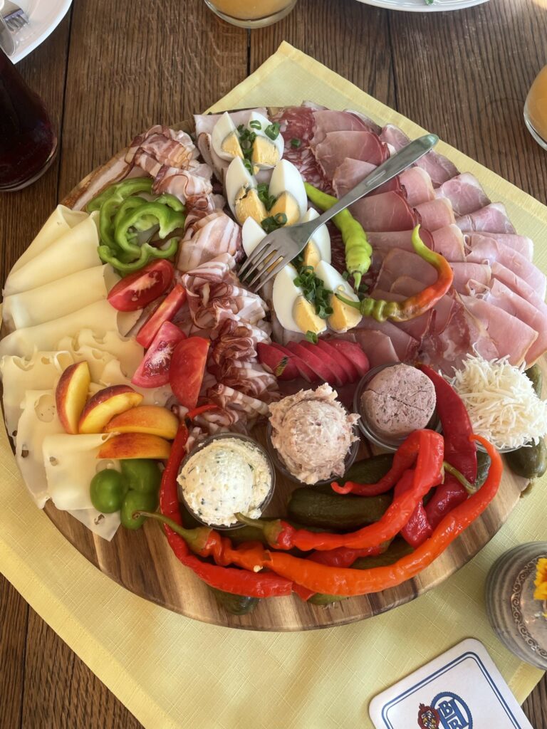 Typical styrian Buschenschank - place you have to visit in Styria - platter with different meats