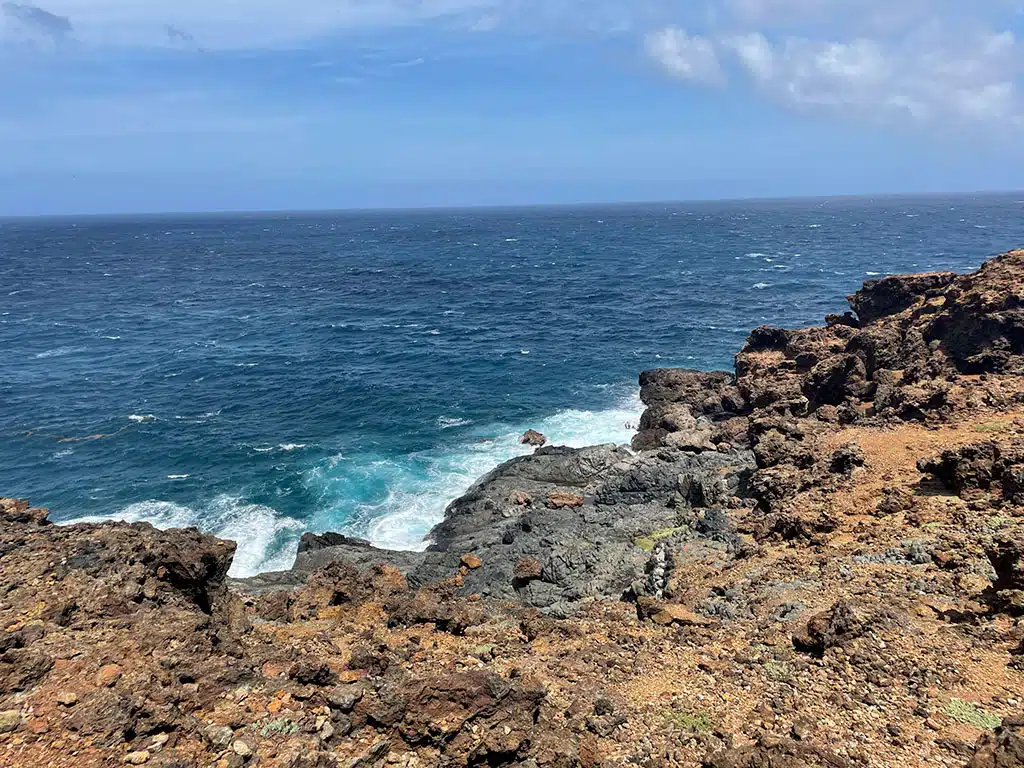 Close up of mighty cliffs and waves on the north coast of Aruba