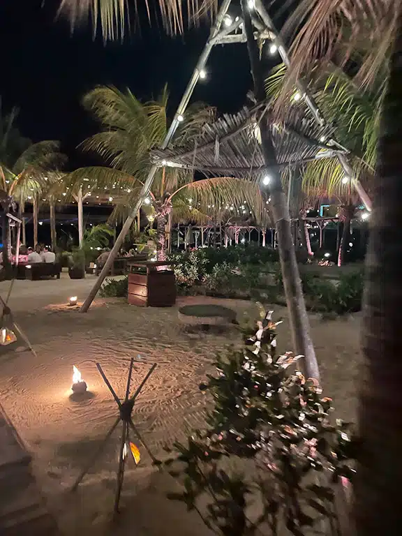 Dinner at mood beach itinerary Curacao, lots of fairy lights, boho style beach restaurant 