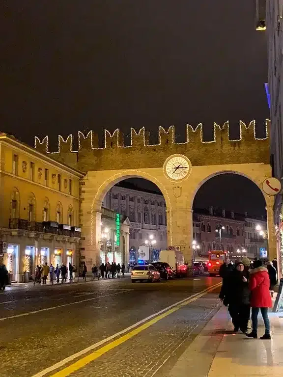 Lit up arches welcoming you to Verona