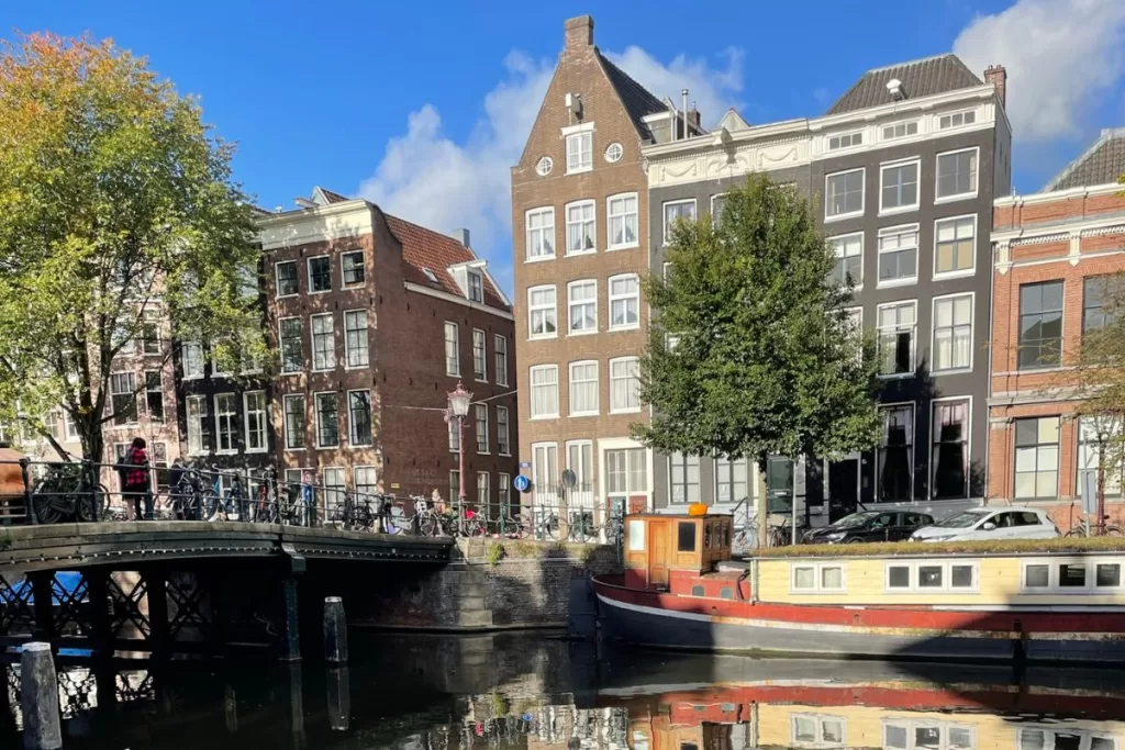Canals of Amsterdam with former warehouses in the background Europe Bucket list