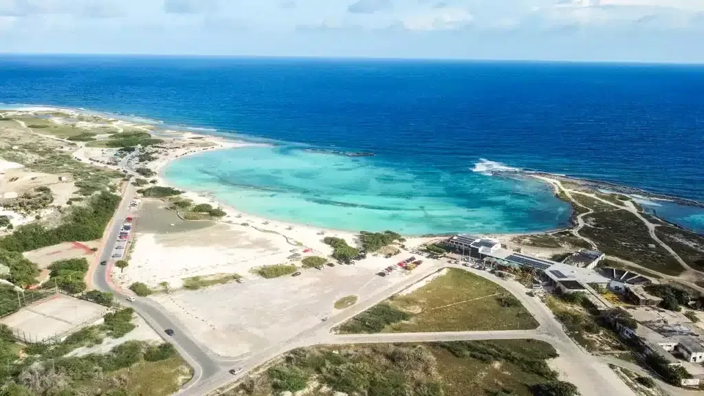 Drone footage of Baby beach in Aruba with beautiful bay with white sands and blue water 