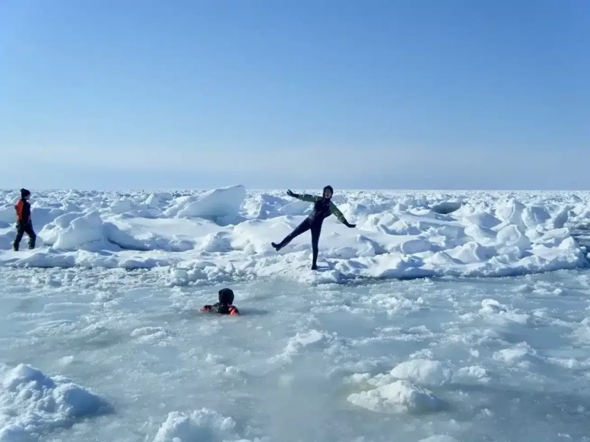 Ice in Hokkaido and people swimming in glacier 
