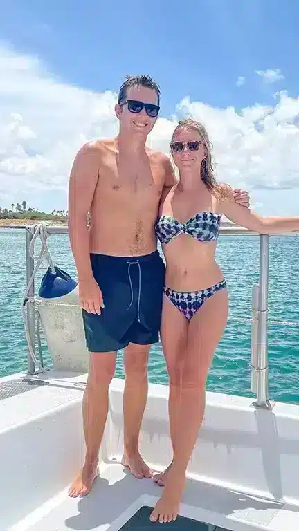 Author with her husband on a boat for snorkeling in the Caribbean