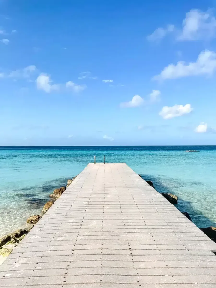 beautiful walkway on a beach into the ocean 