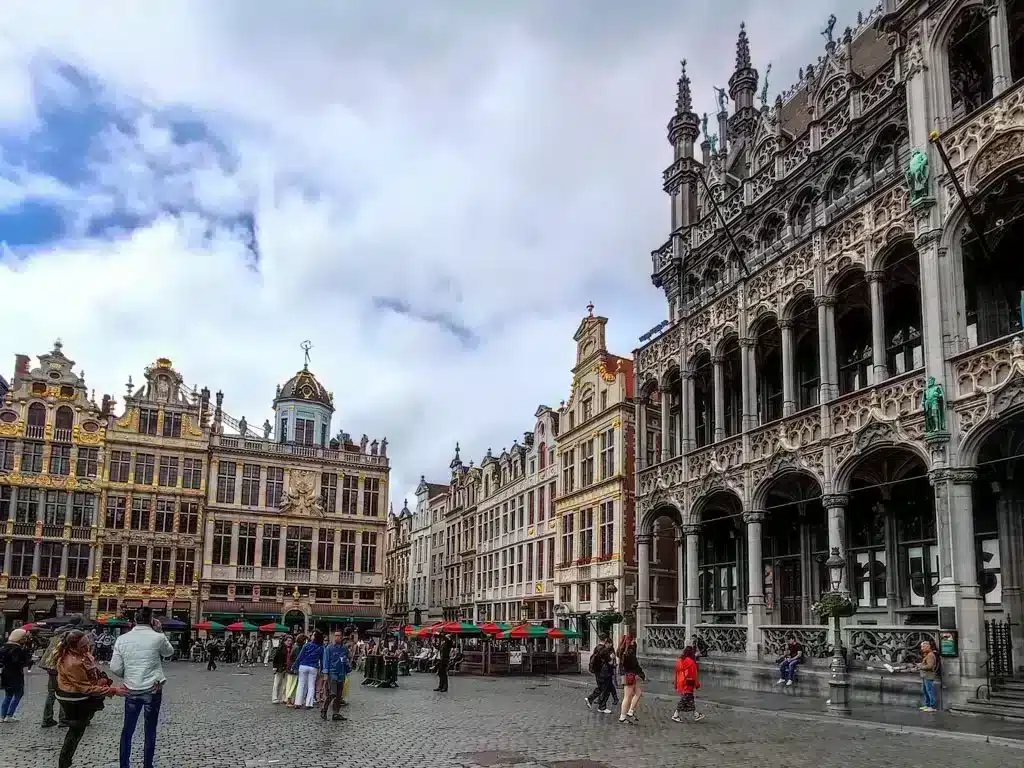 Beautiful shot of architecture of Grand Palace in Brussels, Belgium with blue sky and white fluffy clouds