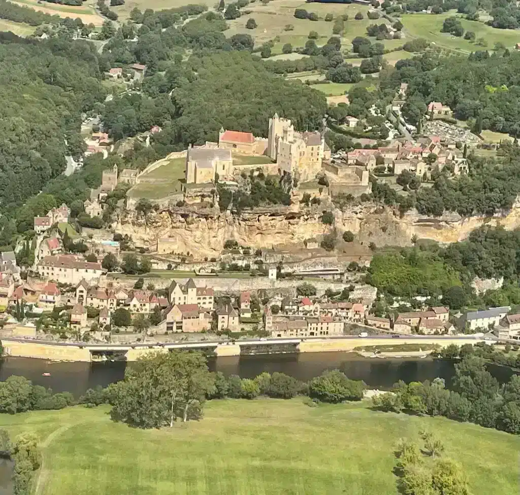 Aerial shots of a village in the dordogne region of france called lbeynac and cazenac