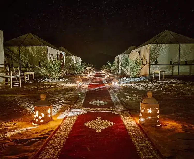 Glamping in the Sahara setup tents at night 
