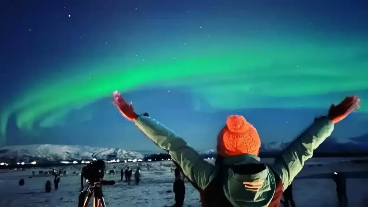 Girl in front of Nordic lights in Norway Europe Bucket list