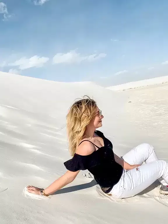 White Sands National Park in New Mexico Blonde girl in the white sand dunes 