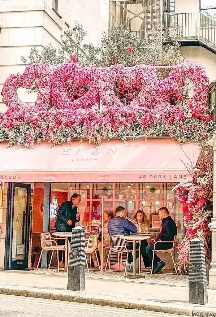 Picture of beautiful restaurant decorated with huge hearts made out of roses all in pink 
