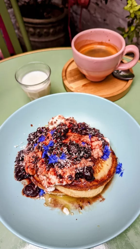 Pancakes with flowers and coffee 