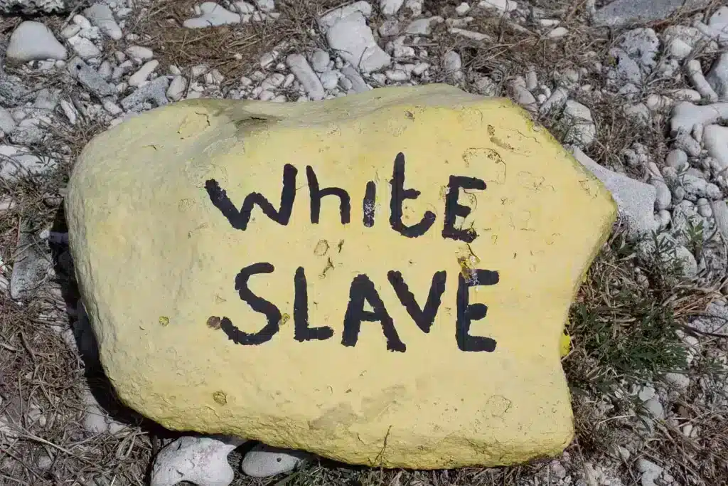Stone with spray paint white slave 