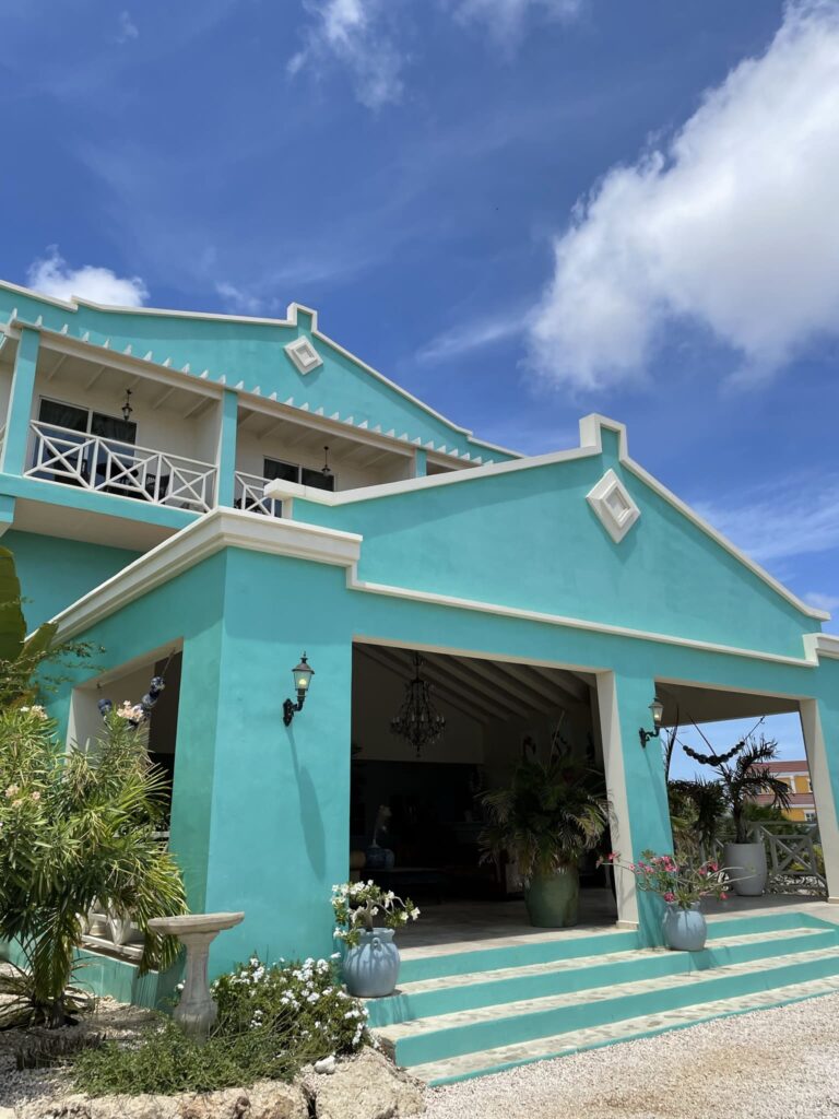Ocean Breeze Boutique Hotel in Bonaire from the outside in bright blue
