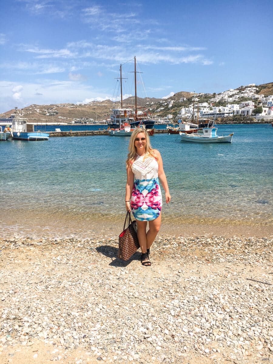 The author in Mykonos on a beach enjoying herself showing that Mykonos is worth visiting