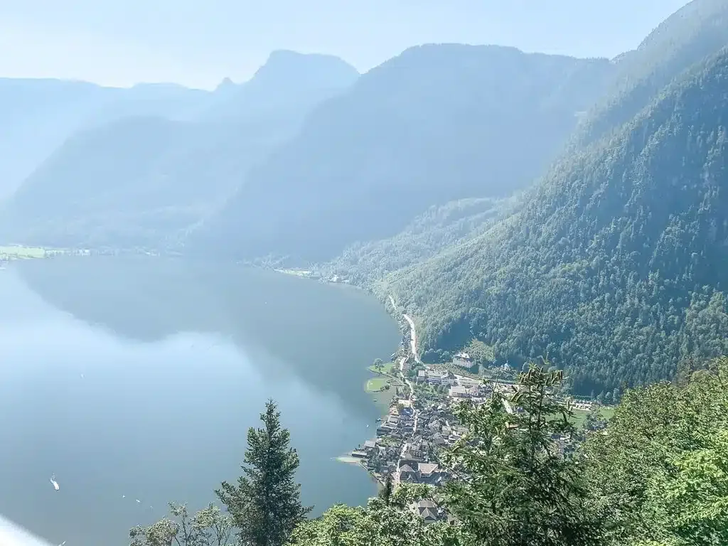 view from above of the beautiful village hallstatt with mountains in the background