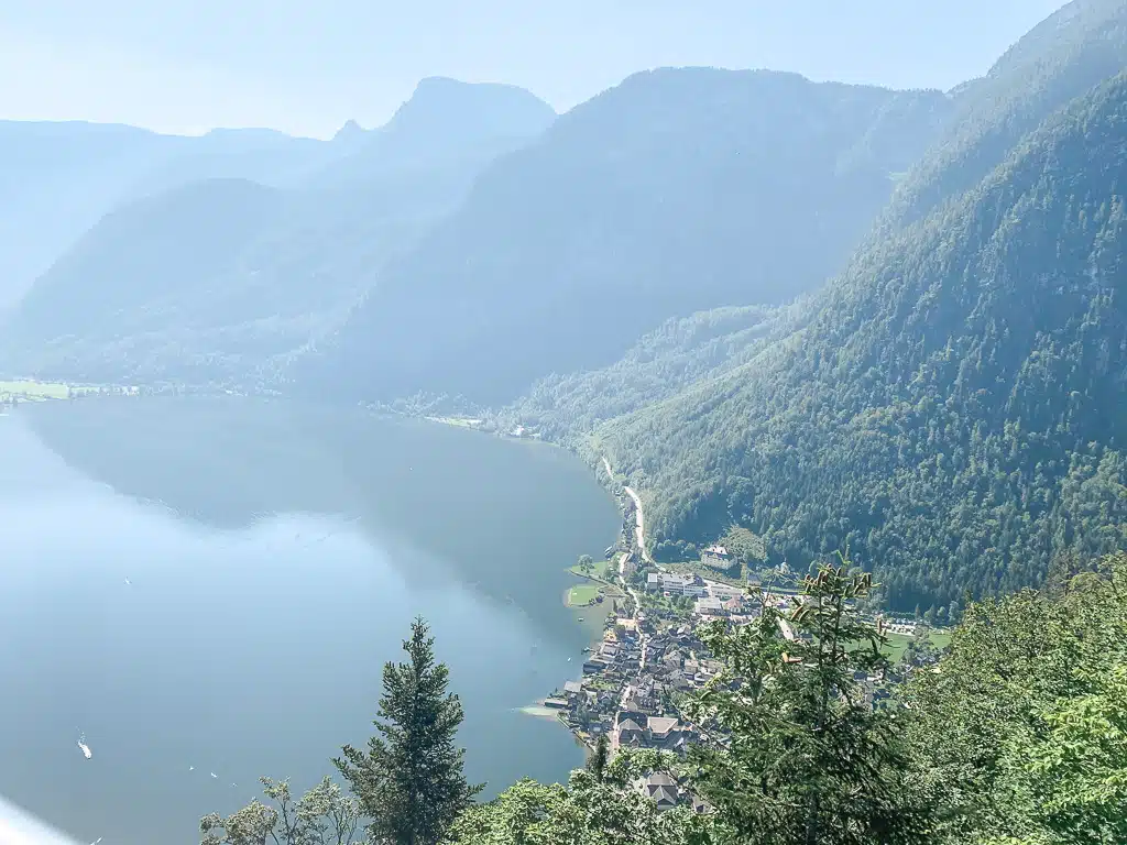 view from above of the beautiful village hallstatt with mountains in the background