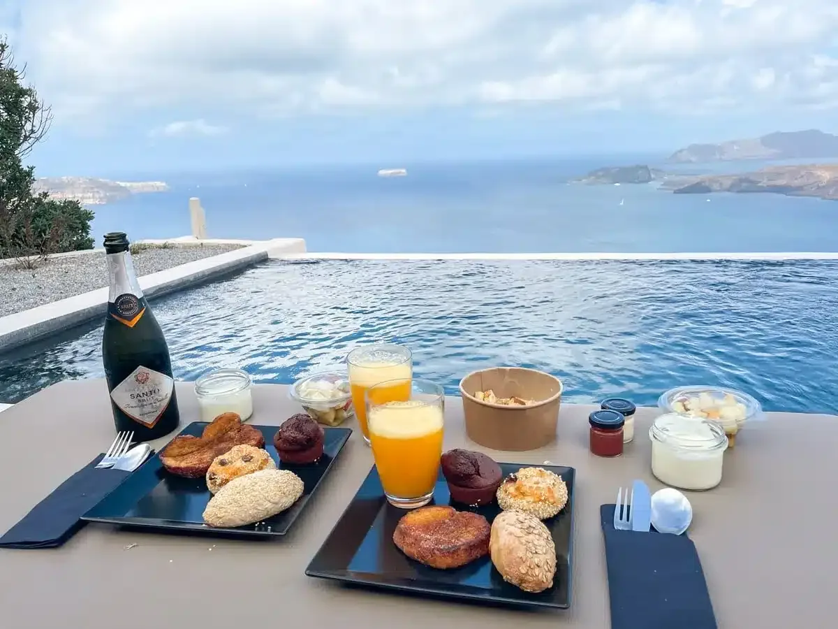 overview of the breakfast spread with a view of the santorini caldera