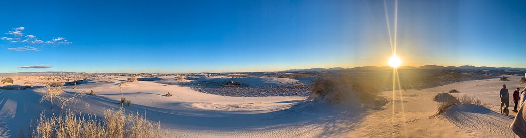 panorama of a sunset with stunning picture of the sun in the white sands national park
