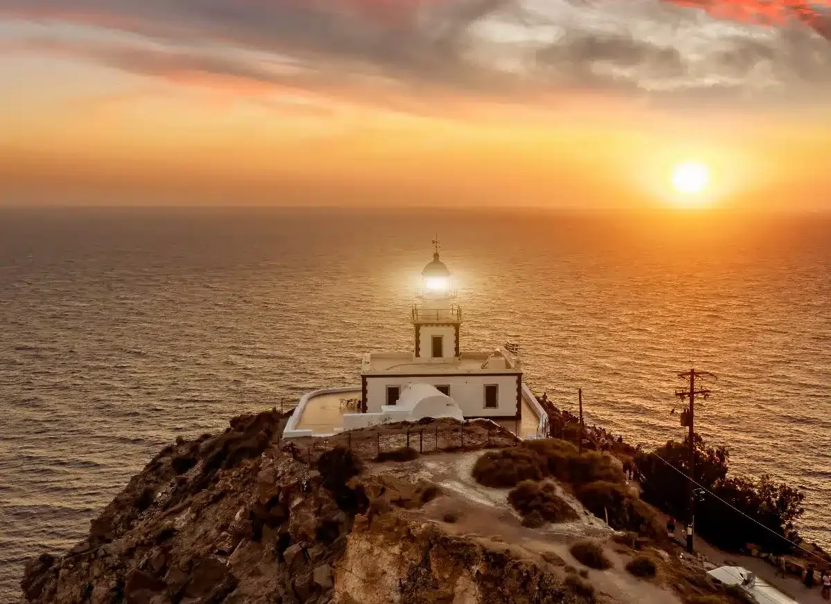 akrotiri lighthouse in santorini sunset 