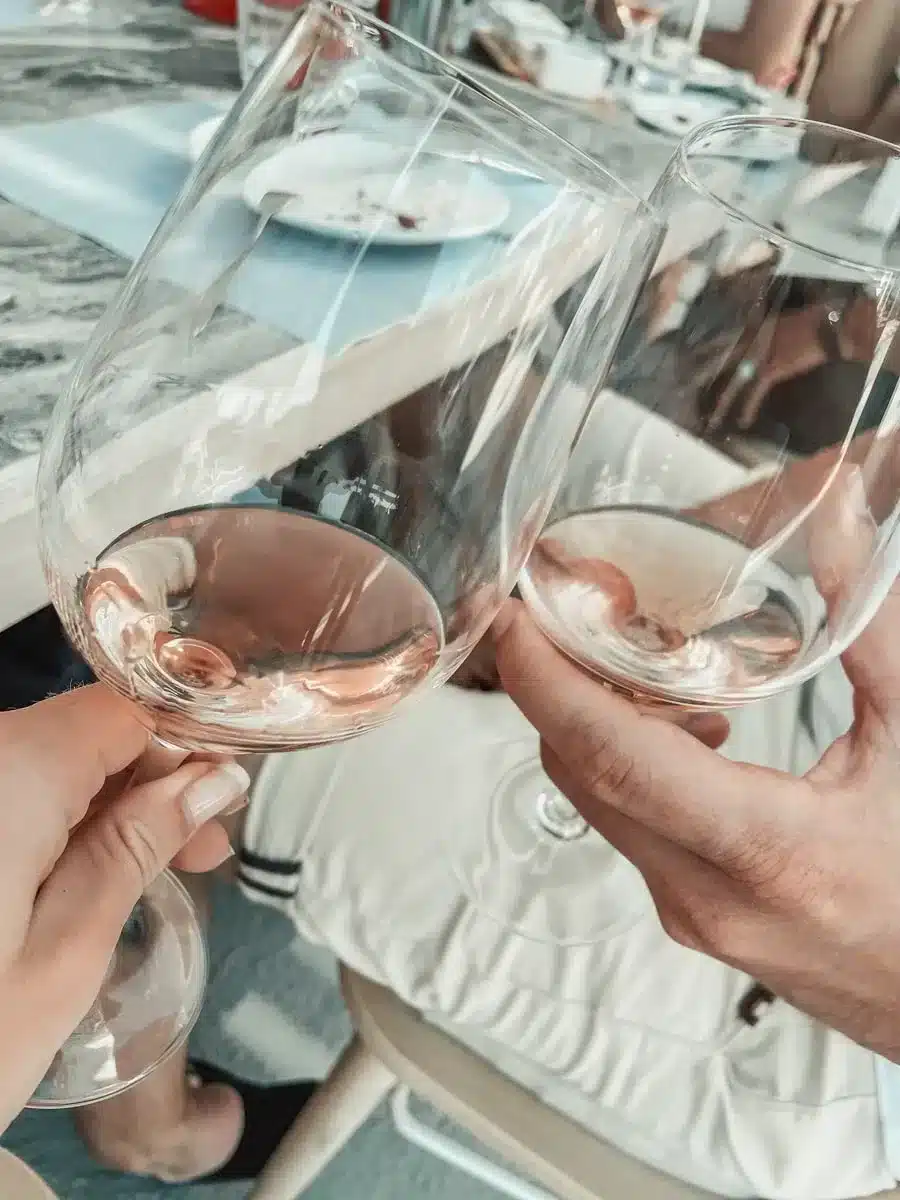 wine glasses with rose wine at a wine tasting being held by the author and her husband on one day in corsica