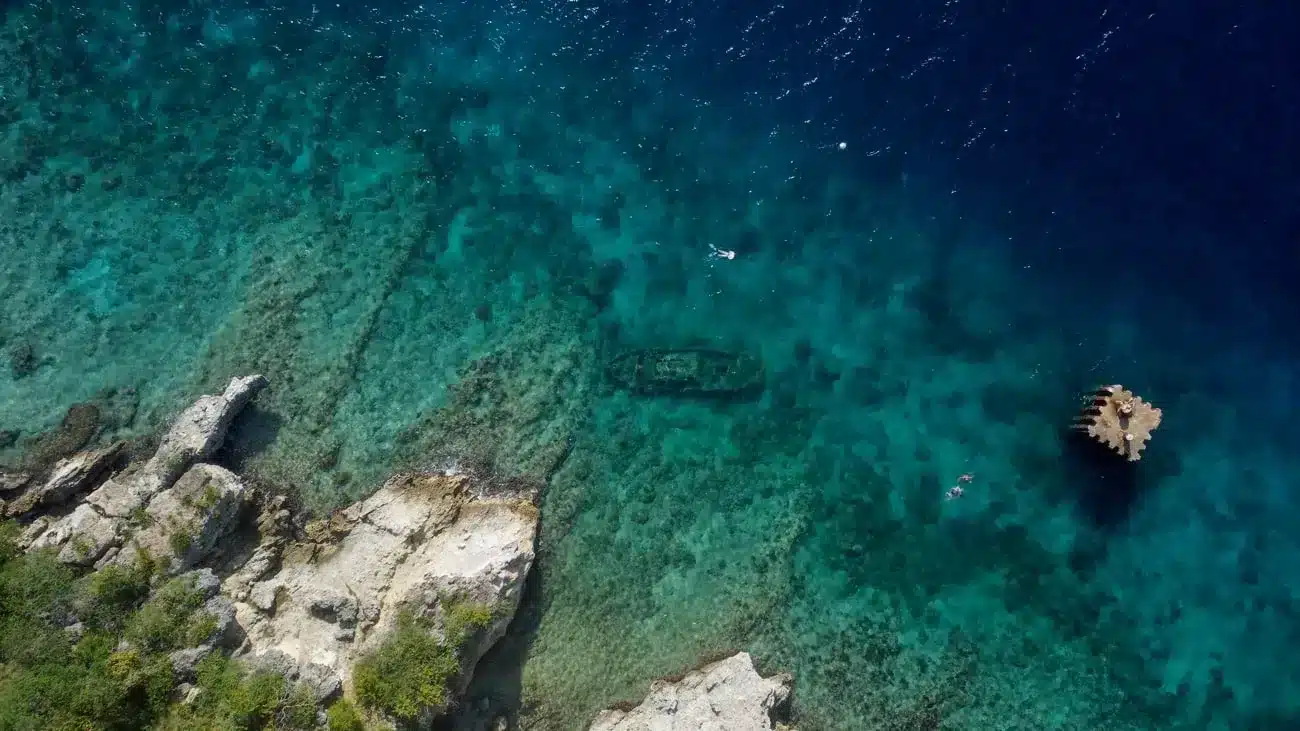 drone shot from tugboat beach in curacao with sunken shipwreck