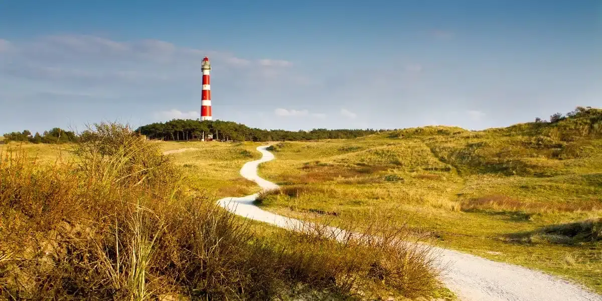 picture of the famous lighthouse of Ameland, ameland vuurtoren with some dunes 