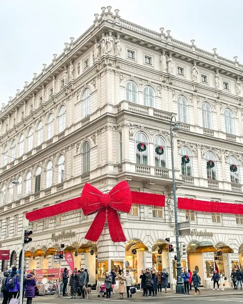 a big red bow as decoration in vienna on a house for christmas
