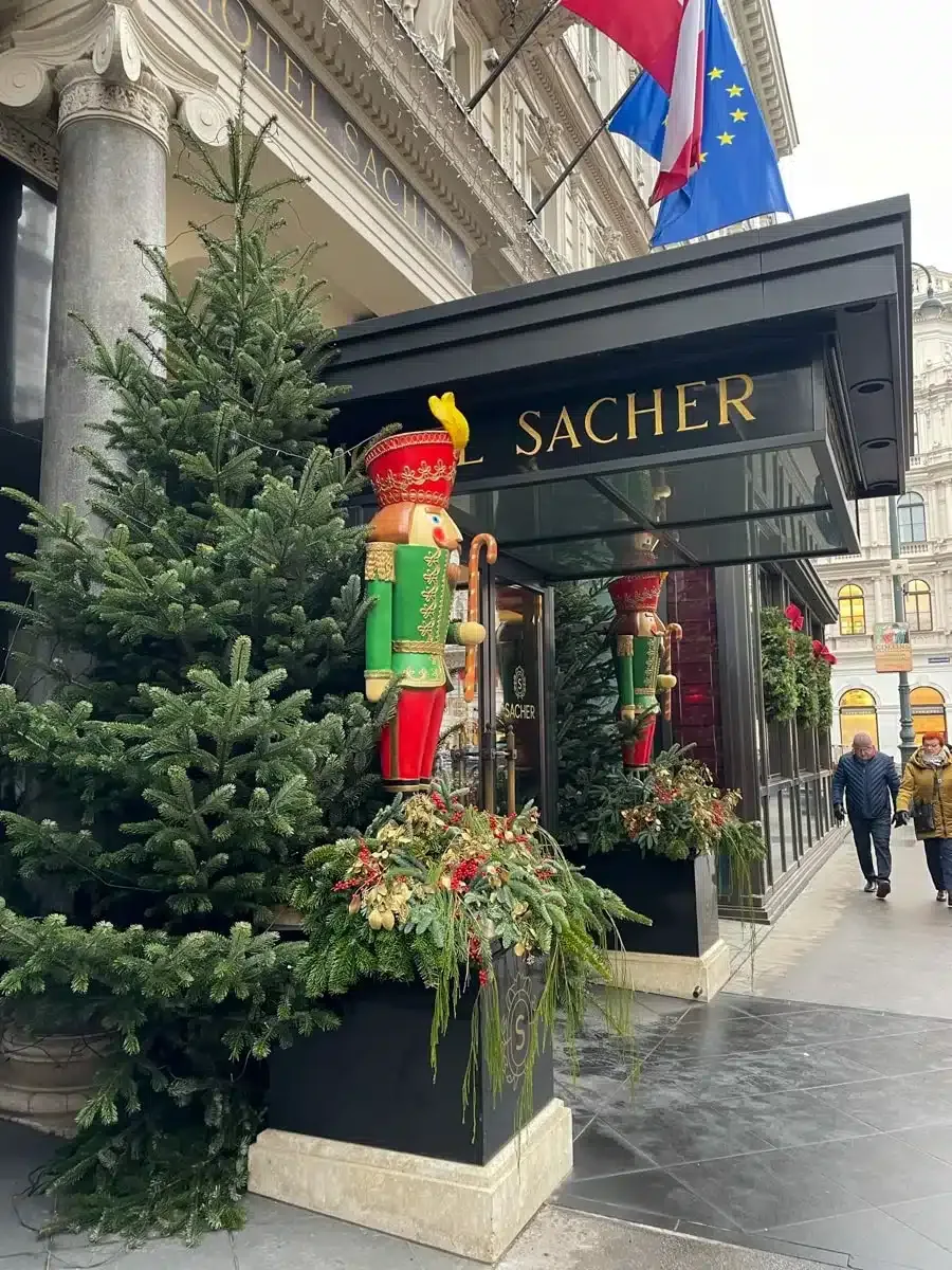 famous storefront of cafe sacher in vienna in winter with christmas decorations