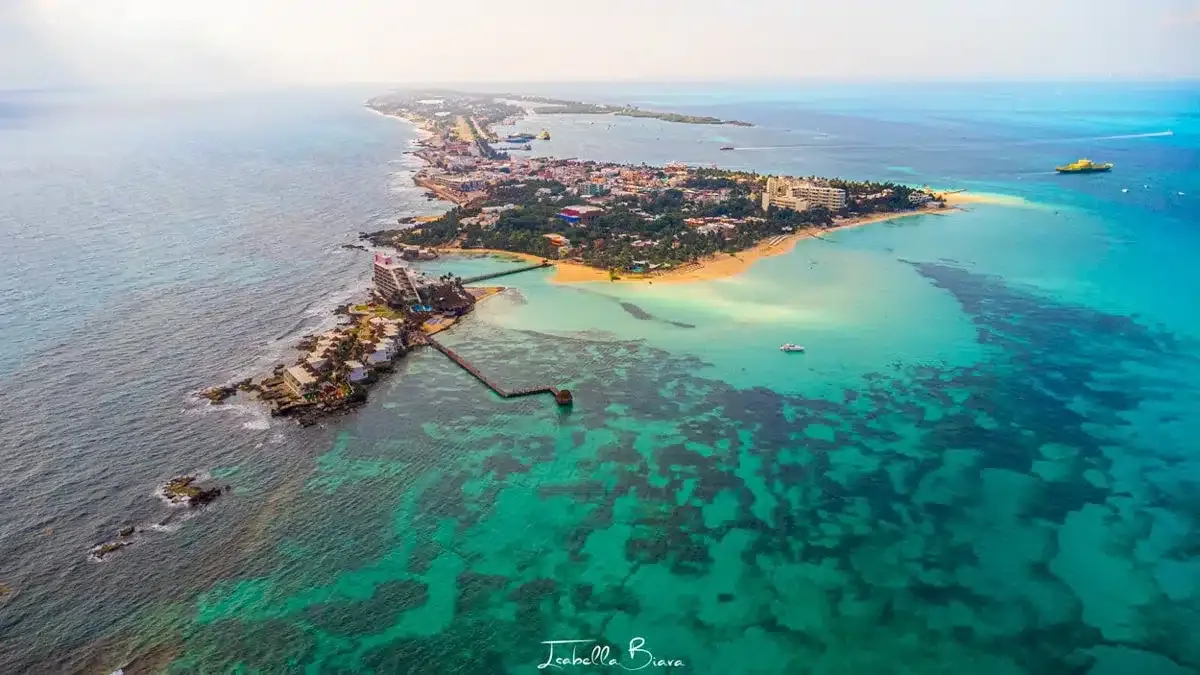 a drone shot of beautiful isla mujeres with stunning blue water 