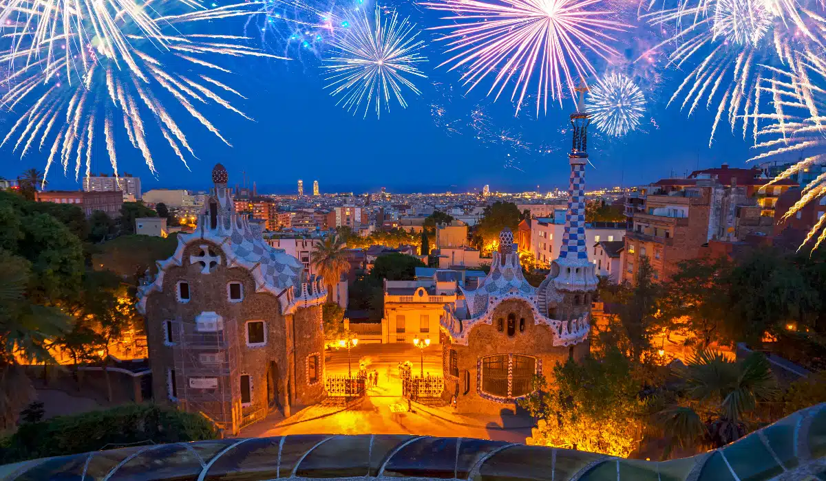 park guell in barcelona with fireworks above