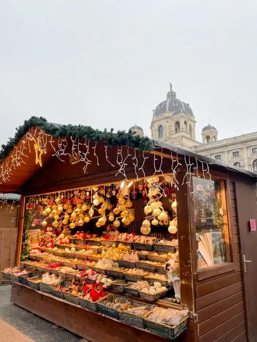 Christmas Market on the Maria Theresien Platz  market stall selling decorations 