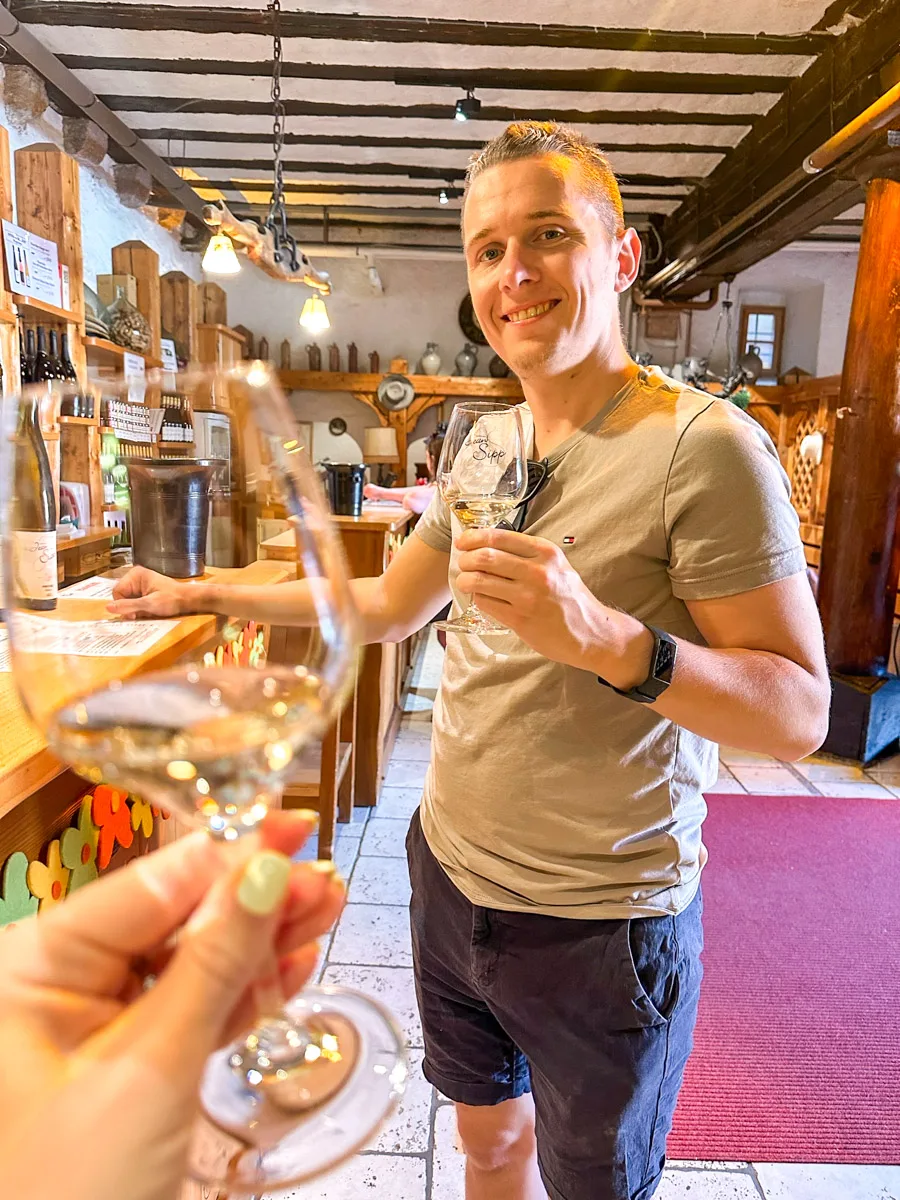 the husband of the author tasting wine in jean sipp in ribeauville on the alsace wine route 