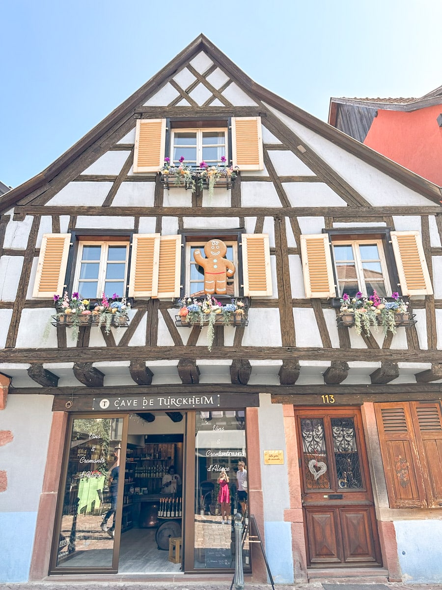 a cute half-timbered house with gingerbread decorations