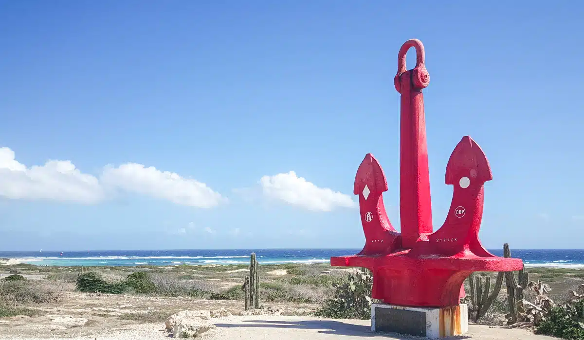 red anchor at seroe colorado in front of the ocean 