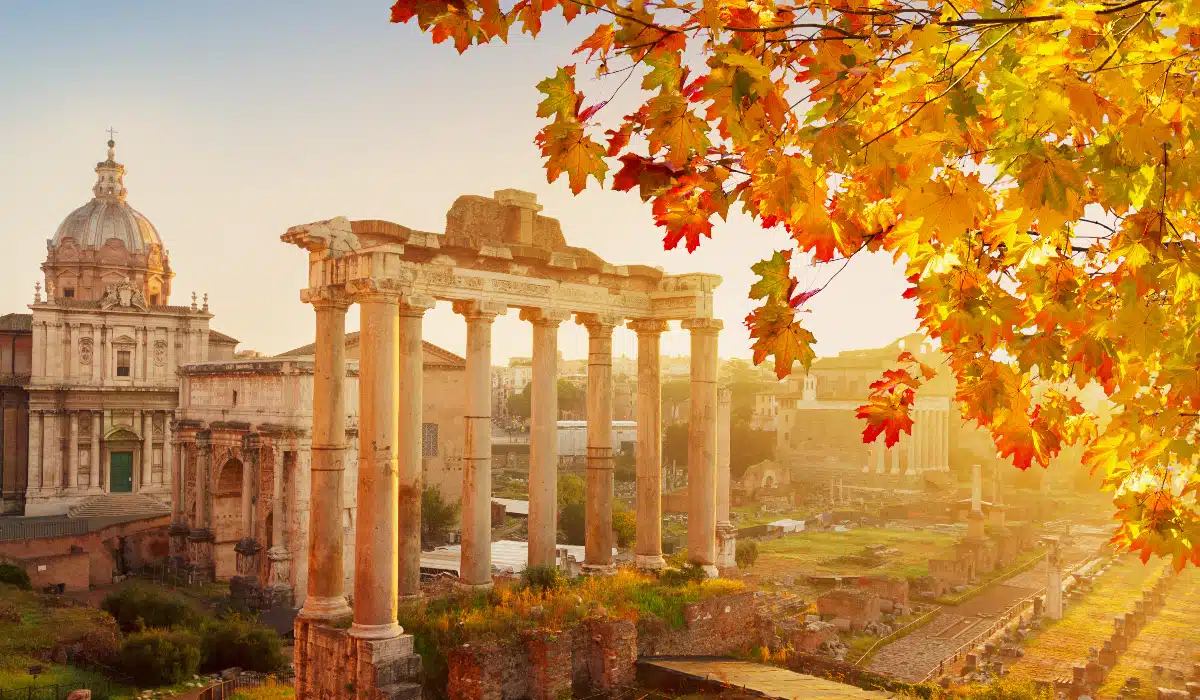 beautiful forum romanum in rome with a tree in front with fall foliage