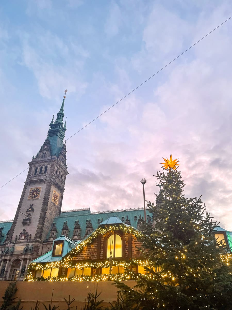 hamburg town hall square with christmas market in front of it