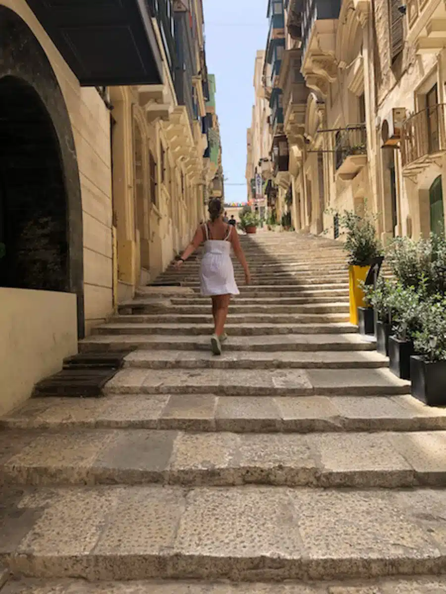 the author running up some steps in valletta