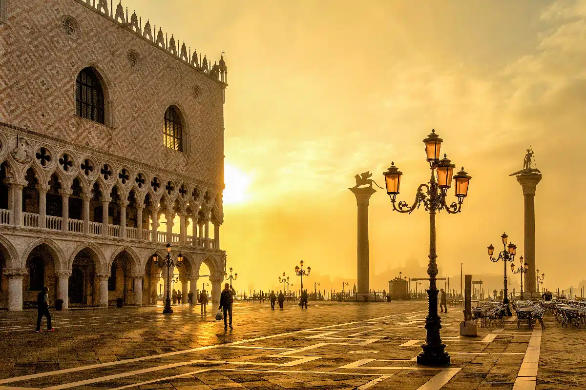 san marco square in venice during sunset in orange light