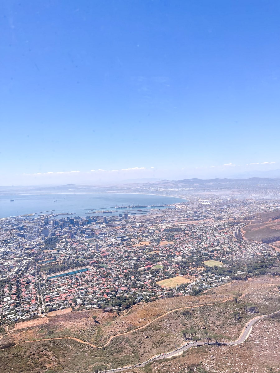 view from the table mountain over the city and the ocean after hiking