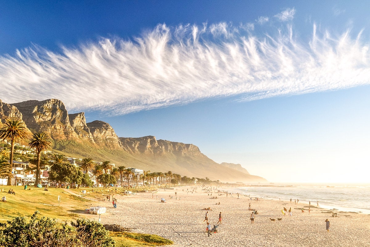 stunning picture of camps bay beach with amazing mountains in the background