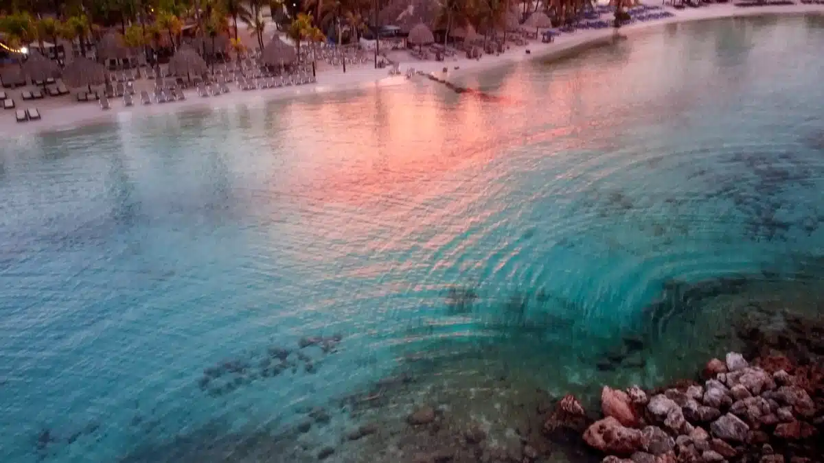 stunning drone shot of a sunrise at mambo beach in curacao