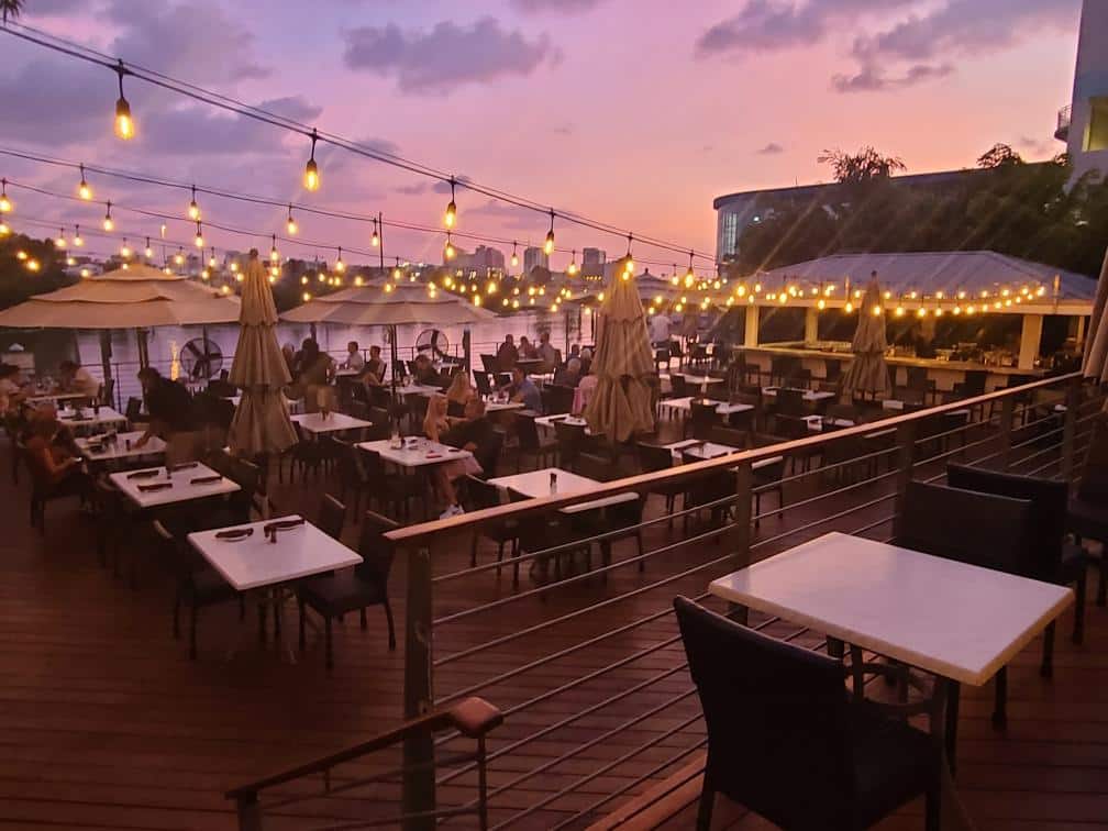 beautiful restaurant in clearwater beach in florida island way grill on a patio with a stunning sunset view