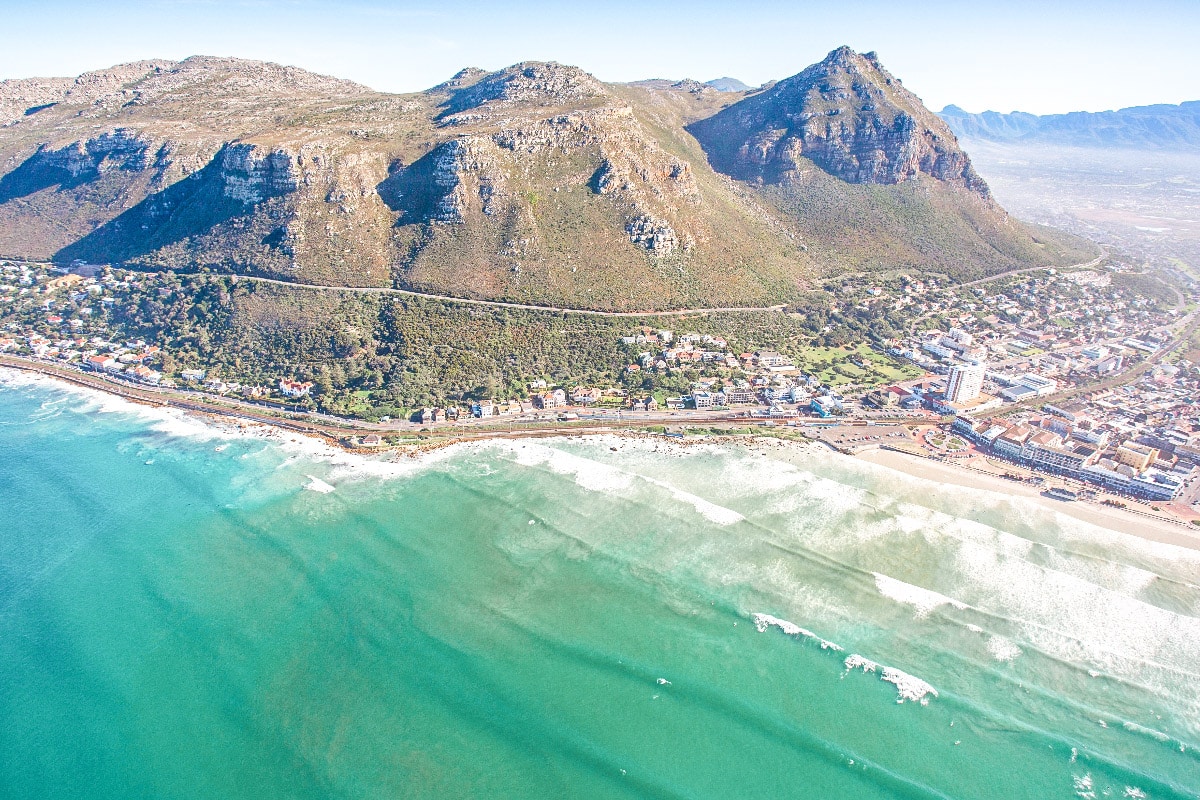 amazing drone shot of the ocean over muizenberg beach 