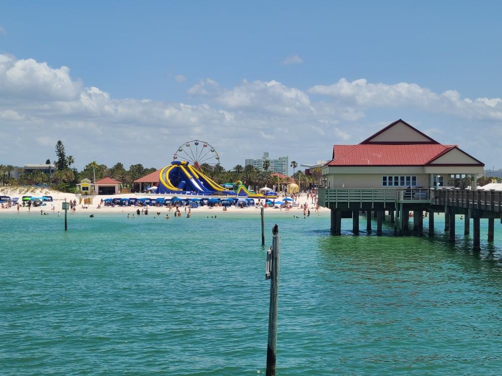 picture of the beach in florida with a ferris wheel in the background