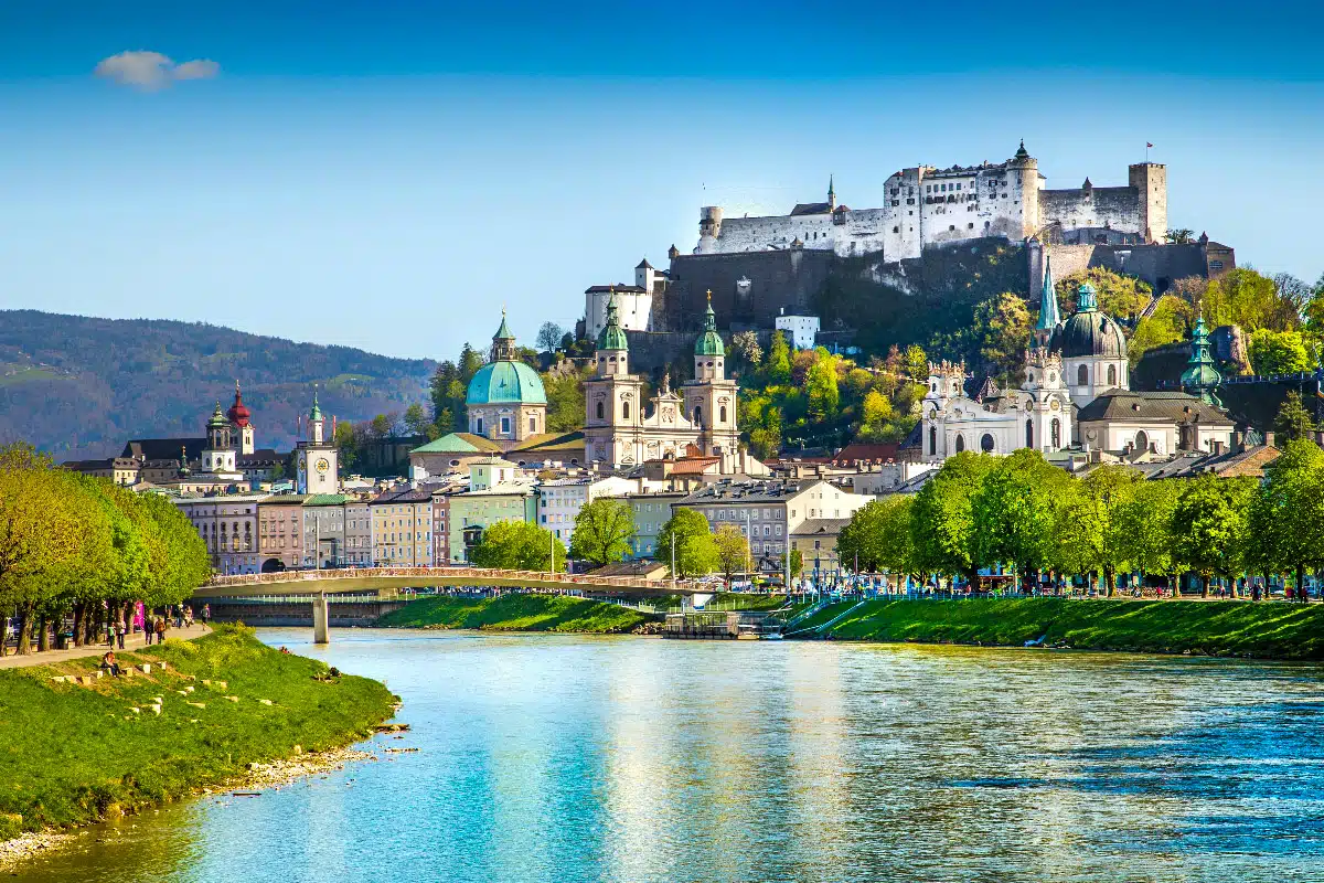 river of salzburg with castle in the background