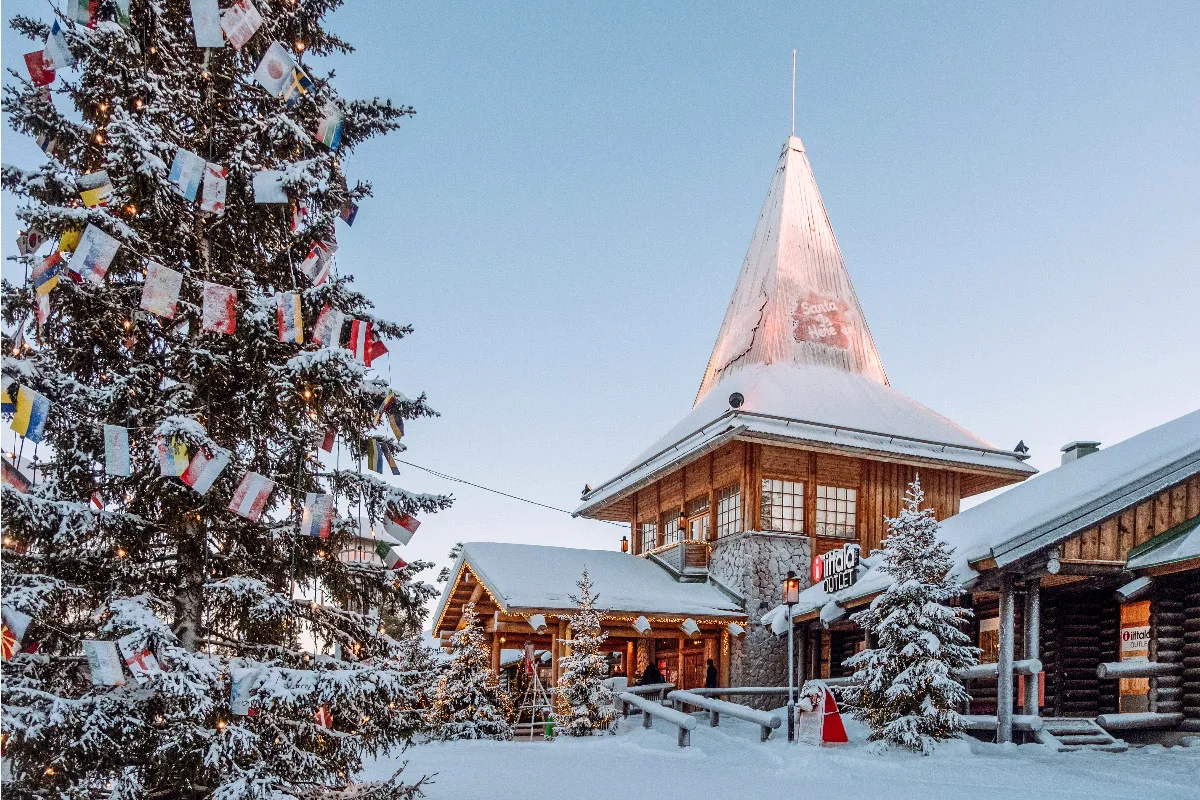 cute little santa clause village in alaska with decorated tree