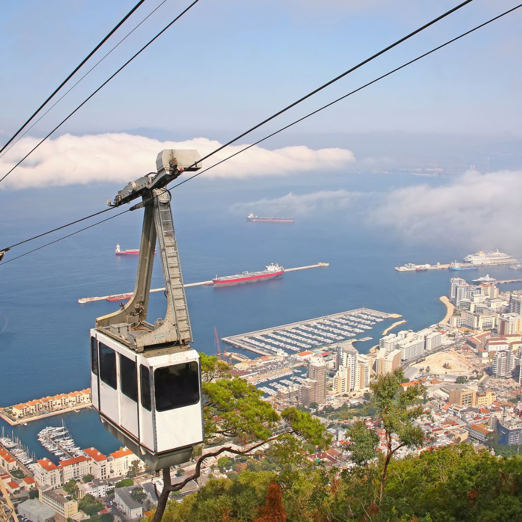 picture of the cable cars going up to the nature reserve in gibraltar. it is definitely one of the must do things in one day in gibraltar, as the view is amazing.